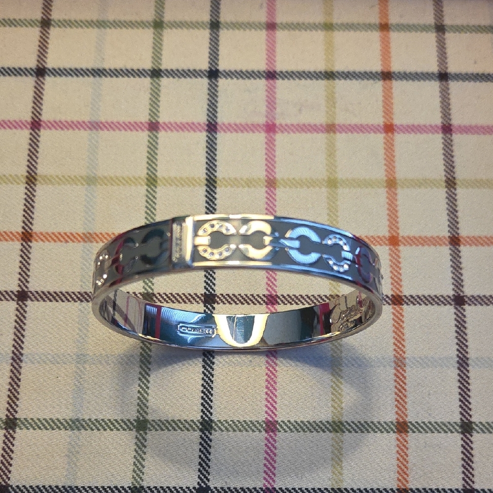 Coach Silver Tone Bracelet with Op Art Logo Design